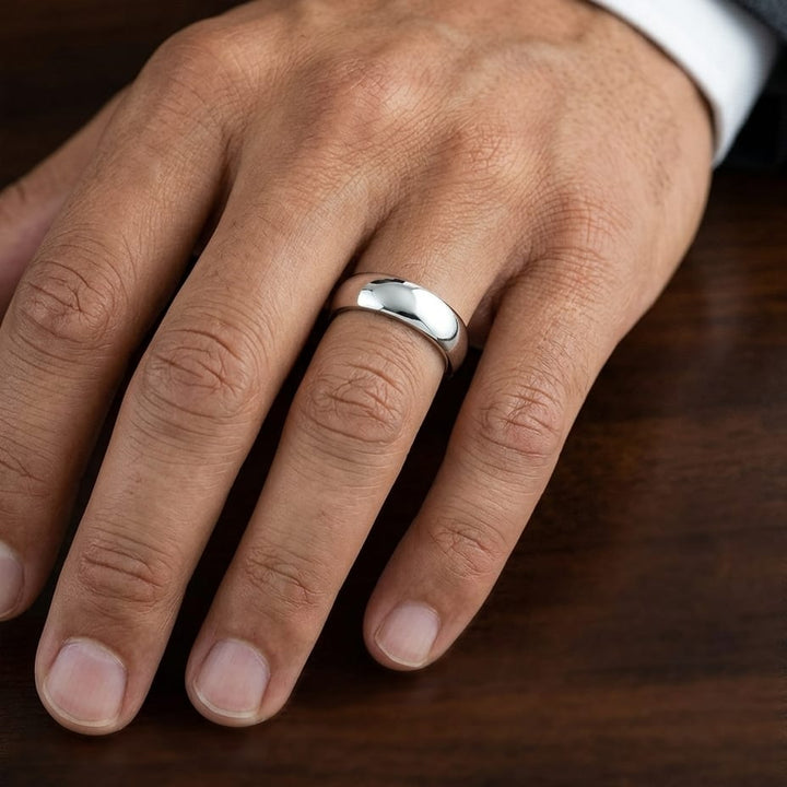7mm Slightly Domed Comfort-Fit Wedding Band in Platinum, worn on hand, masculine close-up