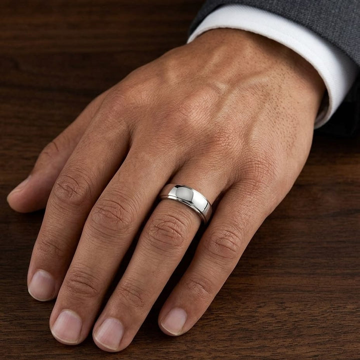 8mm Slightly Domed Comfort-Fit Wedding Band in Platinum, worn on hand, masculine close-up