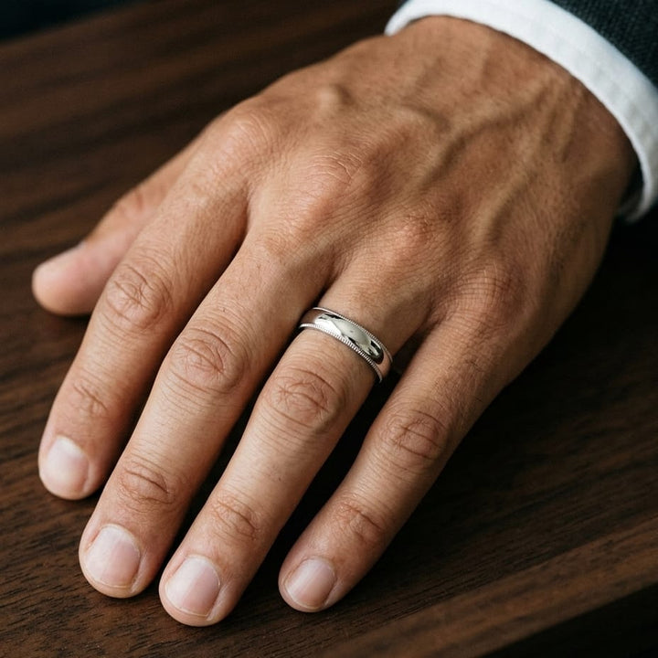 5mm Slightly Domed Milgrain Comfort-Fit Wedding Band in Platinum, worn on hand, masculine close-up