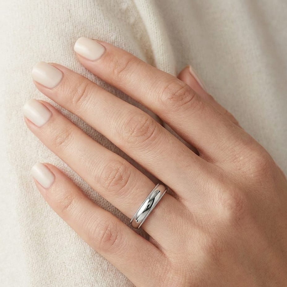 4mm Slightly Domed Double Milgrain Comfort-Fit Wedding Band in Platinum, worn on hand, close-up