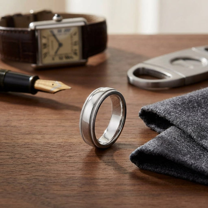 5mm Slightly Domed Double Milgrain Comfort-Fit Wedding Band in Platinum, on walnut surface with pocket square