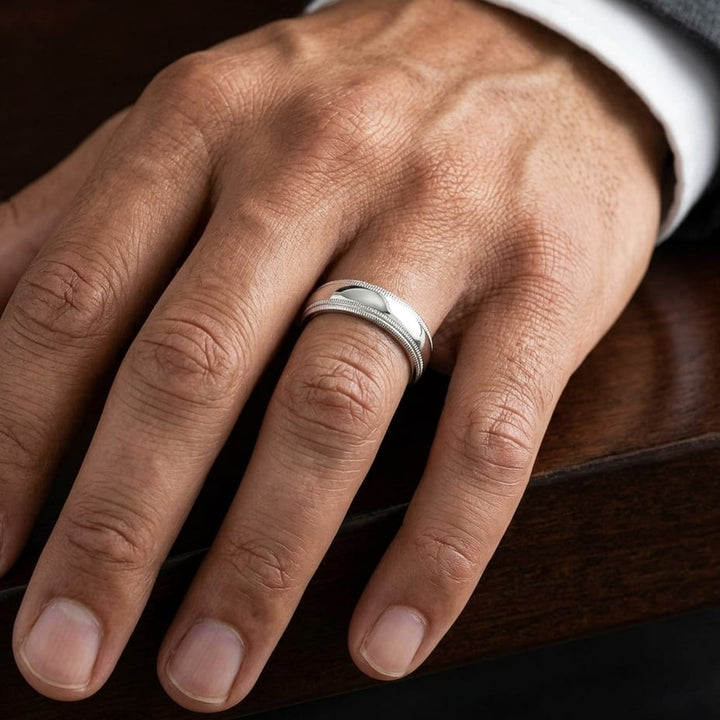 7mm Slightly Domed Double Milgrain Comfort-Fit Wedding Band in Platinum, worn on hand, masculine close-up