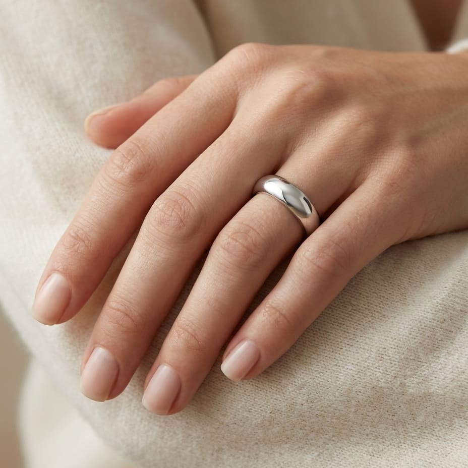 4mm Slightly Domed Super Light Comfort-Fit Wedding Band in Platinum, worn on hand, close-up
