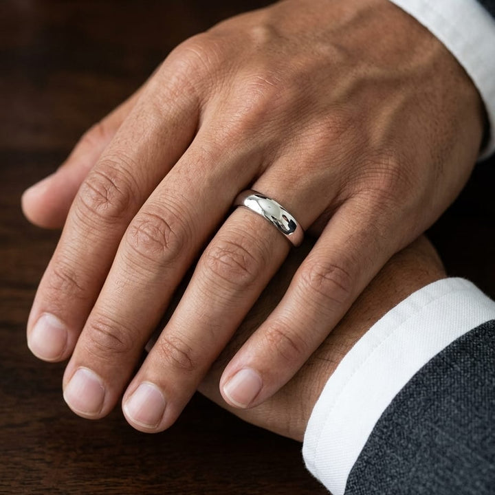 5mm Slightly Domed Super Light Comfort-Fit Wedding Band in Platinum, worn on hand, masculine close-up