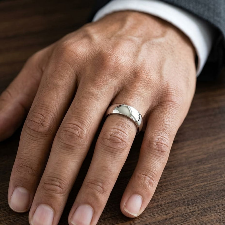 7mm Slightly Domed Super Light Comfort-Fit Wedding Band in Platinum, worn on hand, masculine close-up