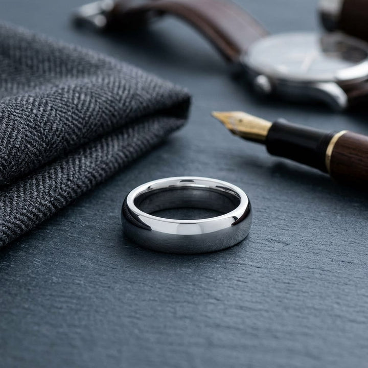 7mm Slightly Domed Super Light Comfort-Fit Wedding Band in Platinum, on walnut surface with pocket square