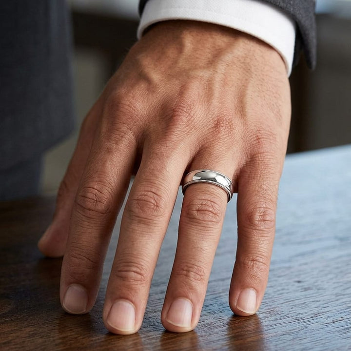 6mm Slightly Domed Super Light Milgrain Comfort-Fit Wedding Band in Platinum, worn on hand, masculine close-up