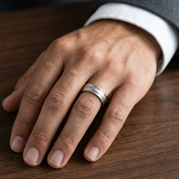 6mm Satin Finish Parallel Groove Carved Wedding Band in Platinum, worn on hand, masculine close-up