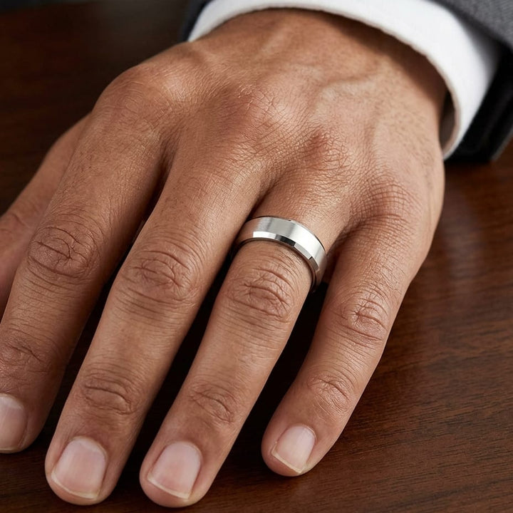 6mm High Polish Carved Wedding Band in Platinum, worn on hand, masculine close-up