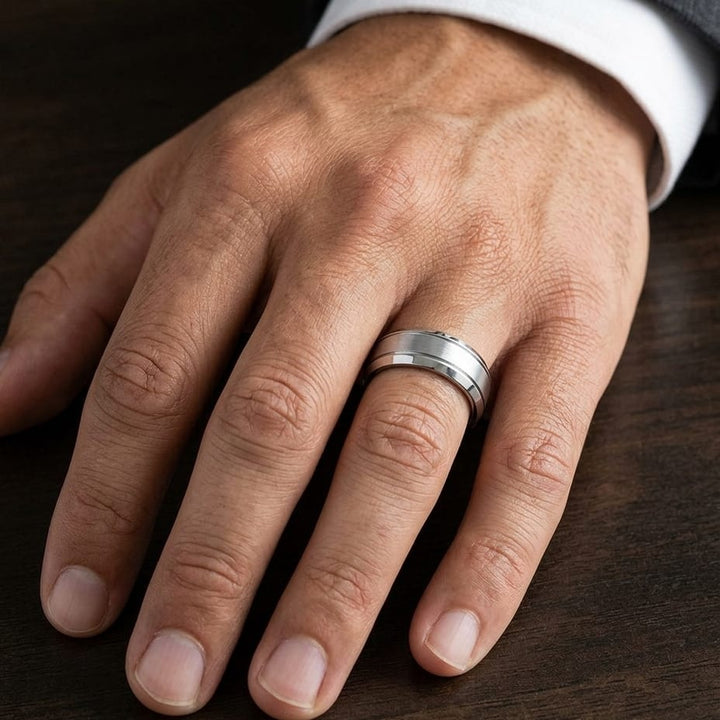 7mm Satin Finish High Polished Beveled Edge Carved Wedding Band in Platinum, worn on hand, masculine close-up