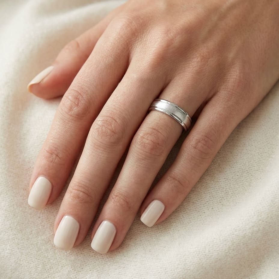 4mm Wired Finish High Polished Round Edge Carved Wedding Band in Platinum, worn on hand, close-up