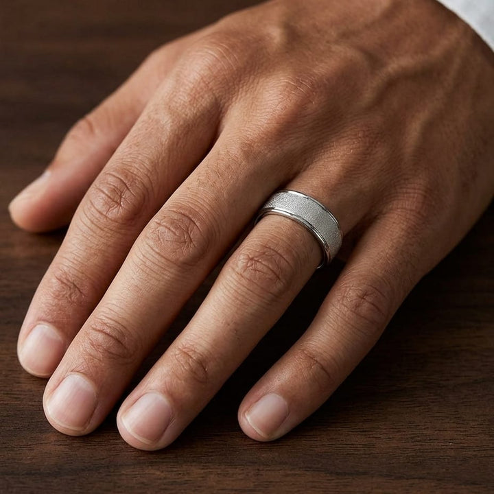 7mm Wired Finish High Polished Round Edge Carved Wedding Band in Platinum, worn on hand, masculine close-up