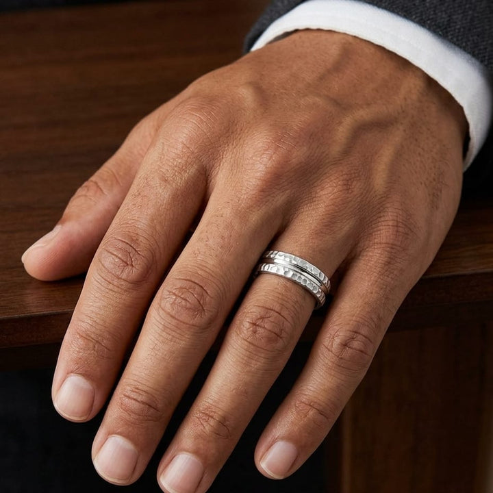 7.5mm Hammered Finish Carved Wedding Band in Platinum, worn on hand, masculine close-up