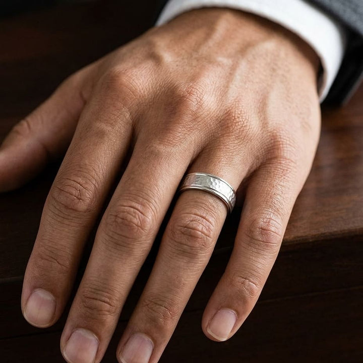 6mm Hammered Finish Carved Wedding Band in Platinum, worn on hand, masculine close-up