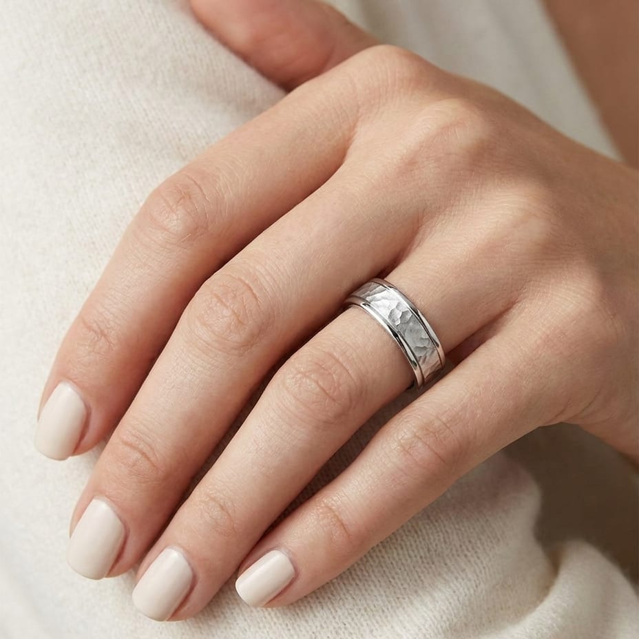 4mm Hammered Finish Carved Wedding Band in Platinum, worn on hand, close-up