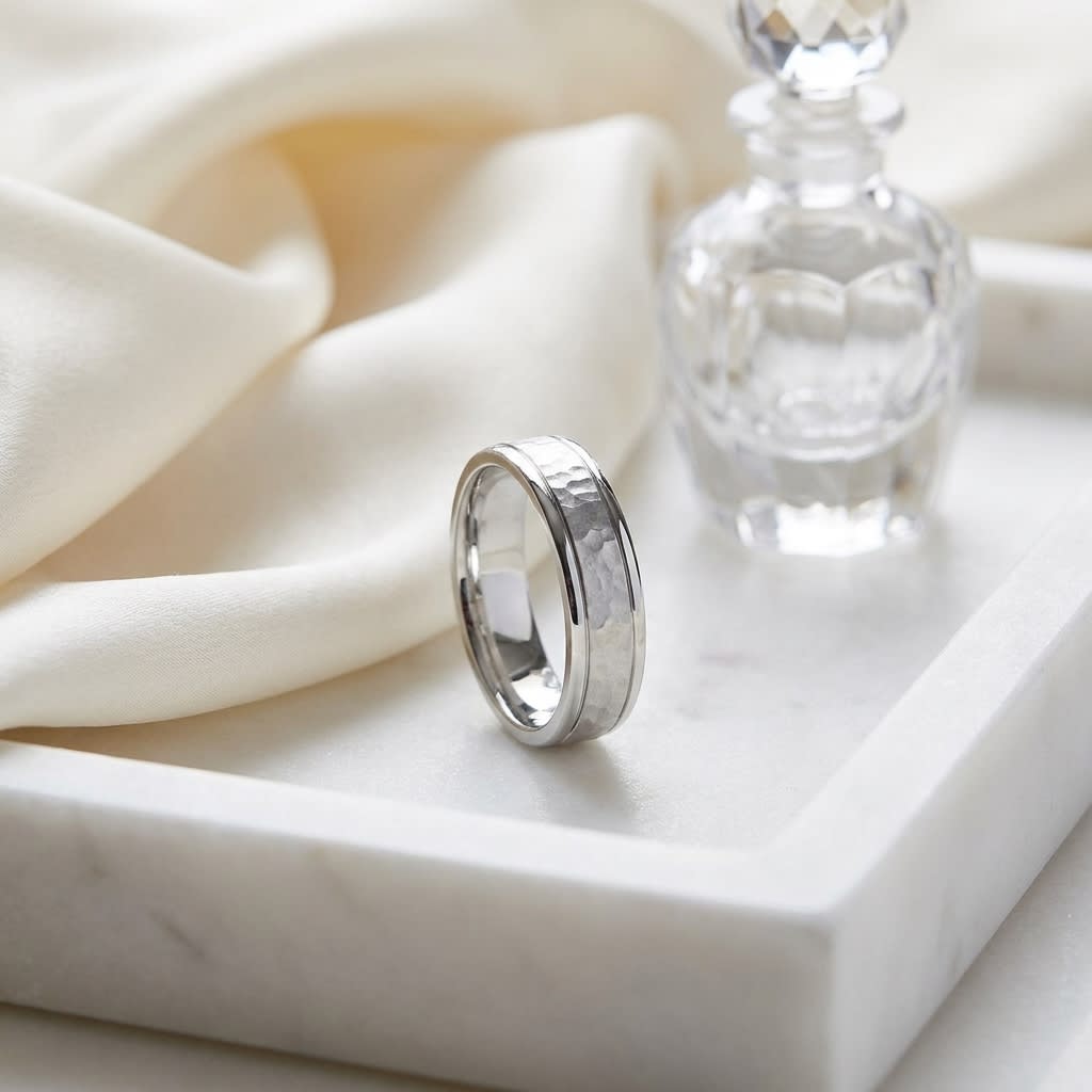 4mm Hammered Finish Carved Wedding Band in Platinum, on marble vanity tray with silk