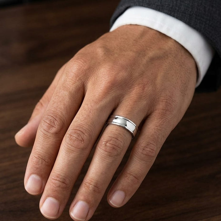 6mm High Polish Round Edge Carved Wedding Band in Platinum, worn on hand, masculine close-up