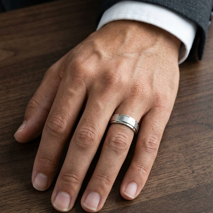 7mm Satin Finish Carved Wedding Band in Platinum, worn on hand, masculine close-up