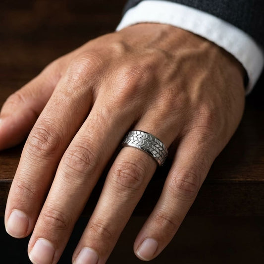 8mm Beveled Edge Treaded Carved Wedding Band in Platinum, worn on hand, masculine close-up