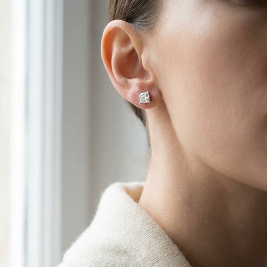 Natural Diamond Princess Cut Four Prong Stud Earrings in Platinum, 1/2 ct. t.w., worn close-up portrait