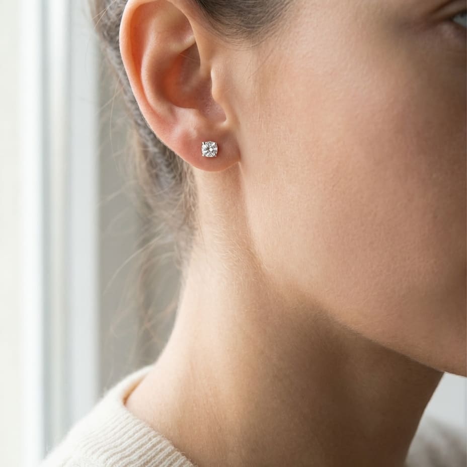 Platinum 4-prong Round Diamond Stud Earrings 1/2ctw (4.0mm Ea), M-n Color, Si2-si3 Clarity, worn close-up portrait