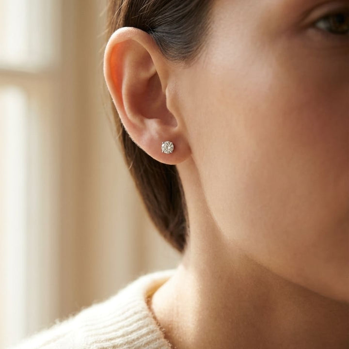 Platinum Bezel Set Round Brilliant Diamond Stud Earrings (0.22 Ct. T.w., Si1-si2 Clarity, H-i Color), worn close-up portrait