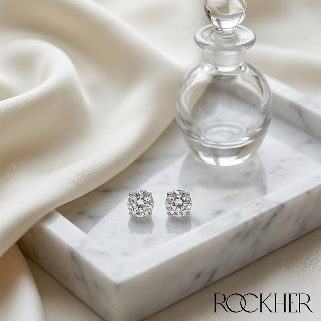 Platinum Bezel Set Round Brilliant Diamond Stud Earrings (0.32 Ct. T.w., Si1-si2 Clarity, H-i Color), on marble vanity tray with silk