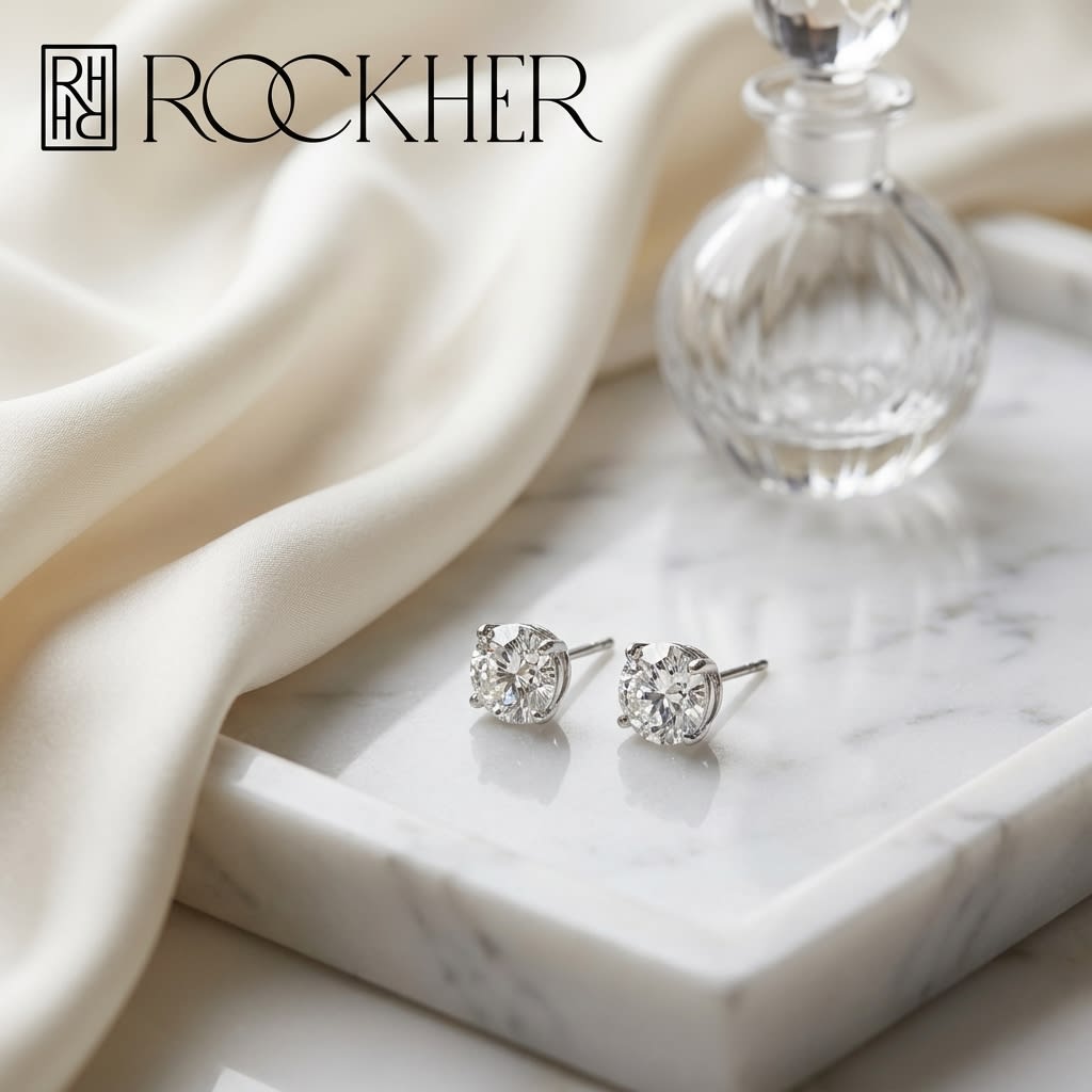 Platinum Bezel Set Round Brilliant Diamond Stud Earrings (0.75 Ct. T.w., Vs1-vs2 Clarity, F-g Color), on marble vanity tray with silk