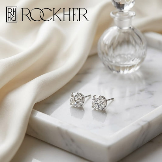 Platinum Bezel Set Round Brilliant Diamond Stud Earrings (0.75 Ct. T.w., Vs1-vs2 Clarity, F-g Color), on marble vanity tray with silk