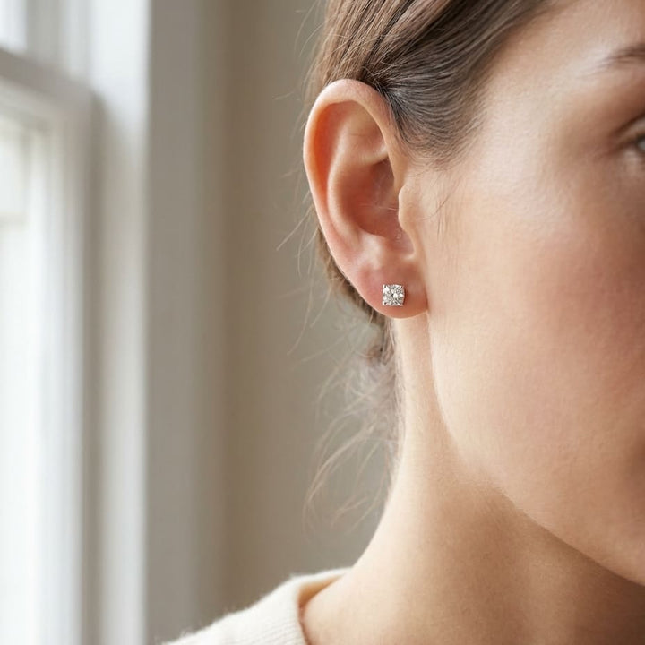 Natural Diamond Round Brilliant Eight Prong Stud Earrings in Platinum, 1 ct. t.w., worn close-up portrait