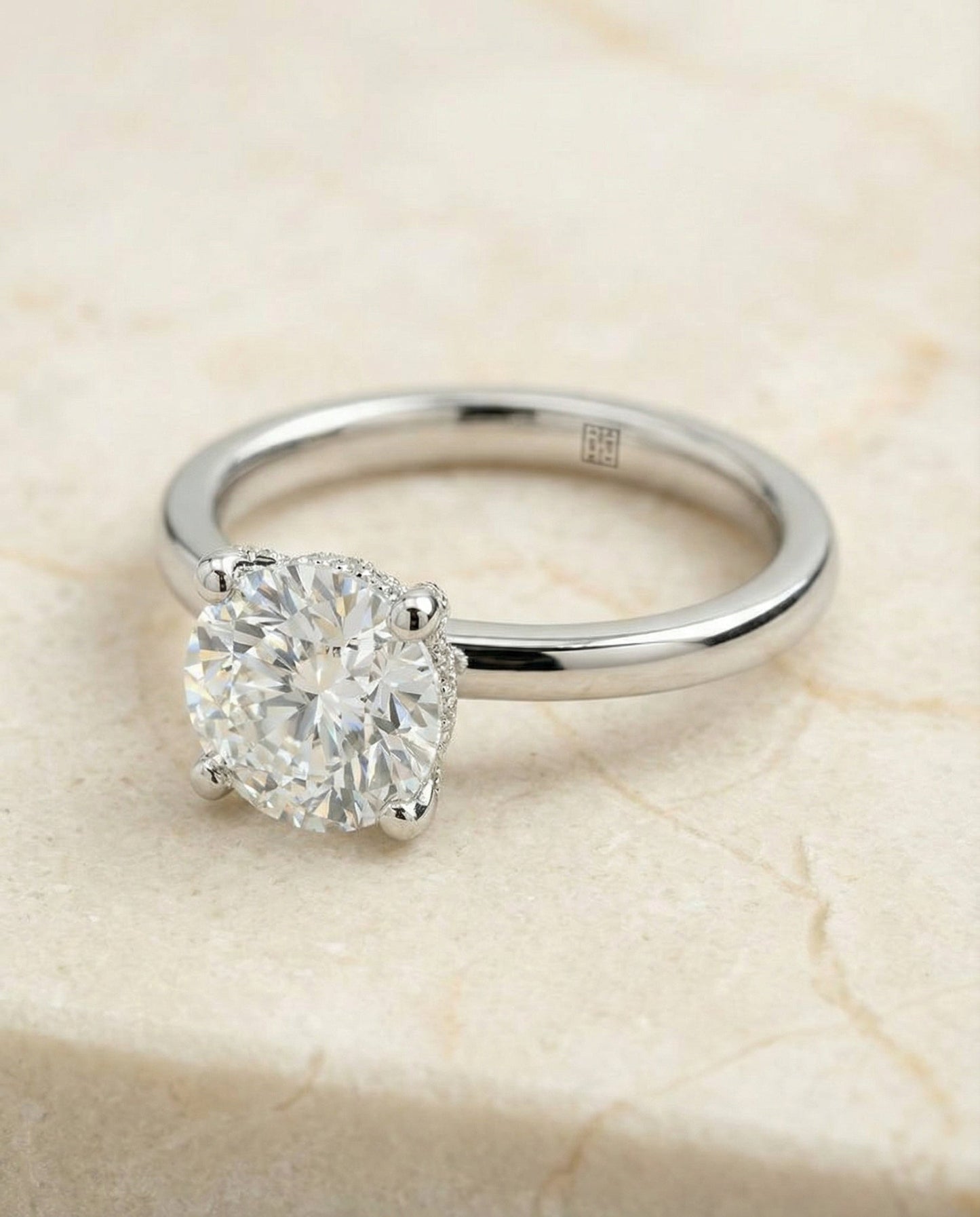 Secret Halo Adorned Prong Solitaire Cushion, in Platinum – lifestyle shot | RockHer