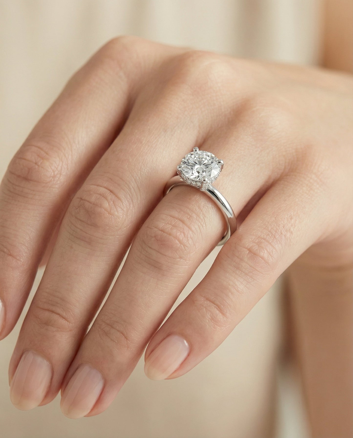 Secret Halo Adorned Prong Solitaire Cushion, in Platinum – lifestyle shot | RockHer