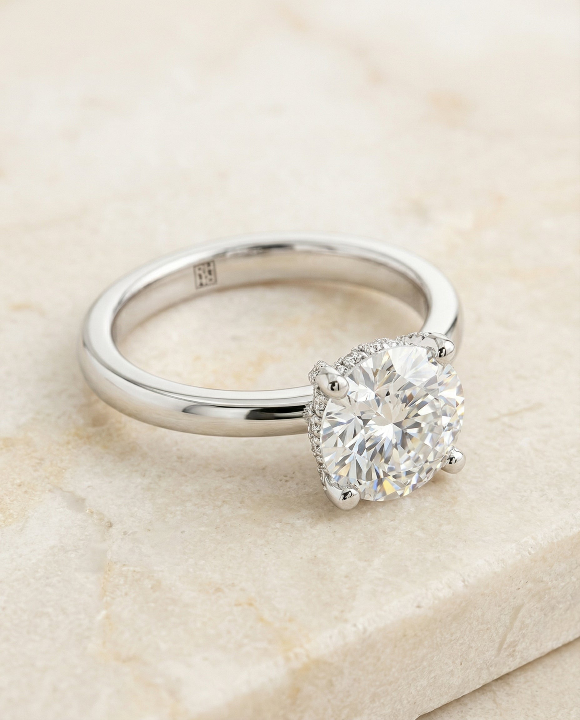 Secret Halo Adorned Prong Solitaire Cushion, in Platinum – side profile | RockHer