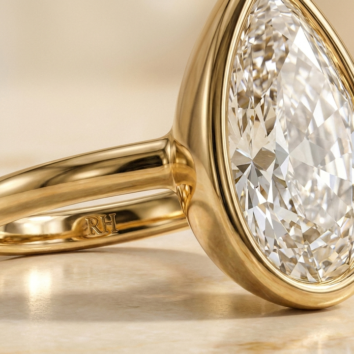 The Agnes Select bezel solitaire briolette engagement ring in 18k yellow gold — construction detail — RockHer