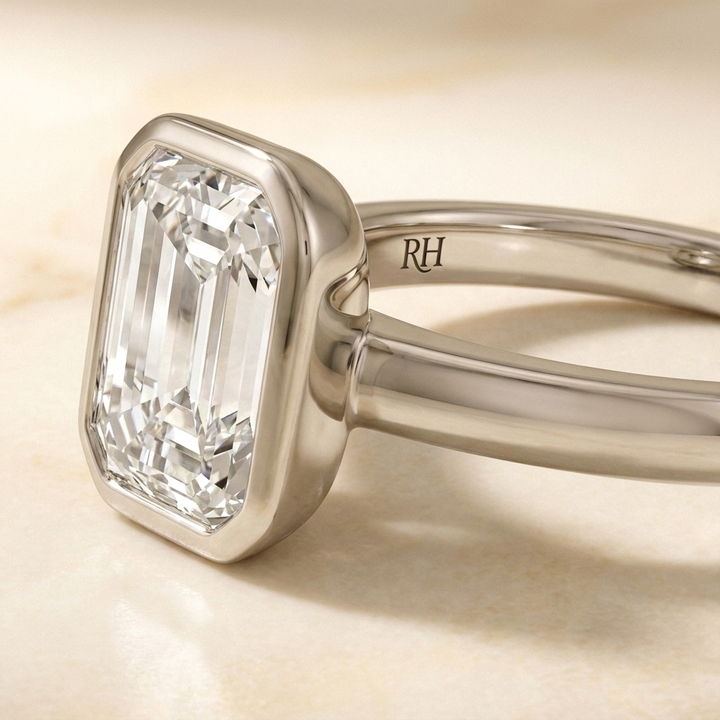The Agnes Select bezel solitaire emerald cut engagement ring in 18k white gold — construction detail — RockHer