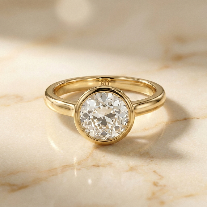 The Agnes Select bezel solitaire old european cut engagement ring in 18k yellow gold — front view — RockHer