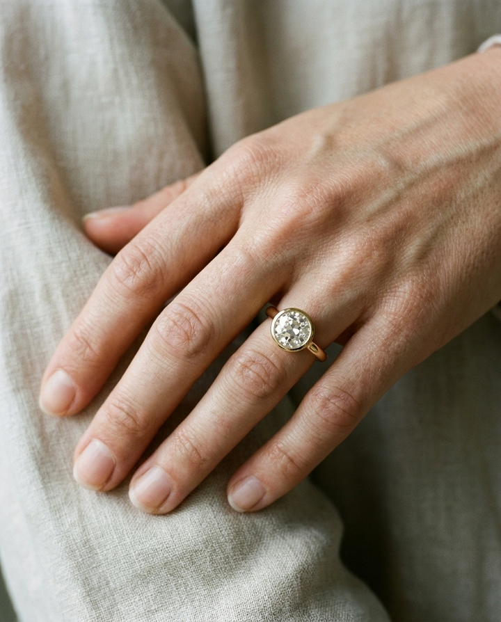 The Agnes Select bezel solitaire old european cut engagement ring in 18k yellow gold — on hand — RockHer
