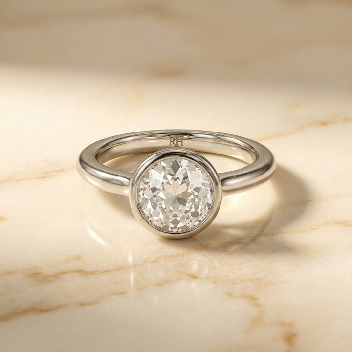 The Agnes Select bezel solitaire old european cut engagement ring in 18k white gold — front view — RockHer