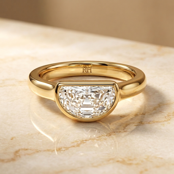 The Agnes Select bezel solitaire half cut engagement ring in 18k yellow gold — front view — RockHer