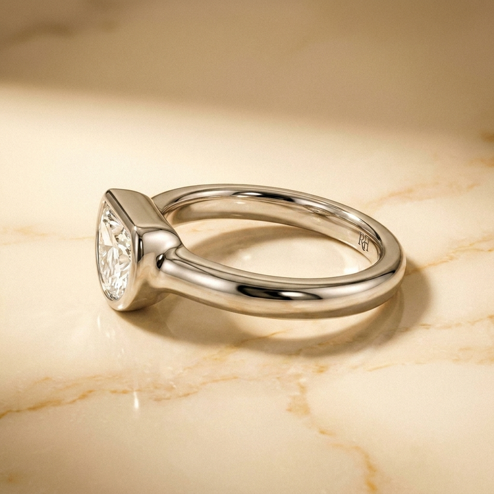The Agnes Select bezel solitaire half cut engagement ring in 18k white gold — side profile — RockHer