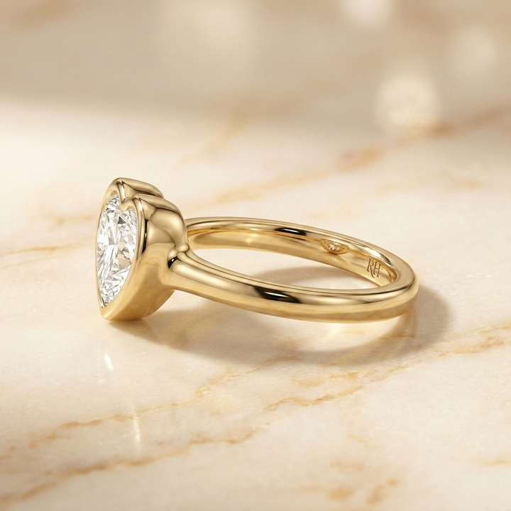 Agnes Heart bezel solitaire engagement ring setting in 18K Yellow Gold — side profile — RockHer