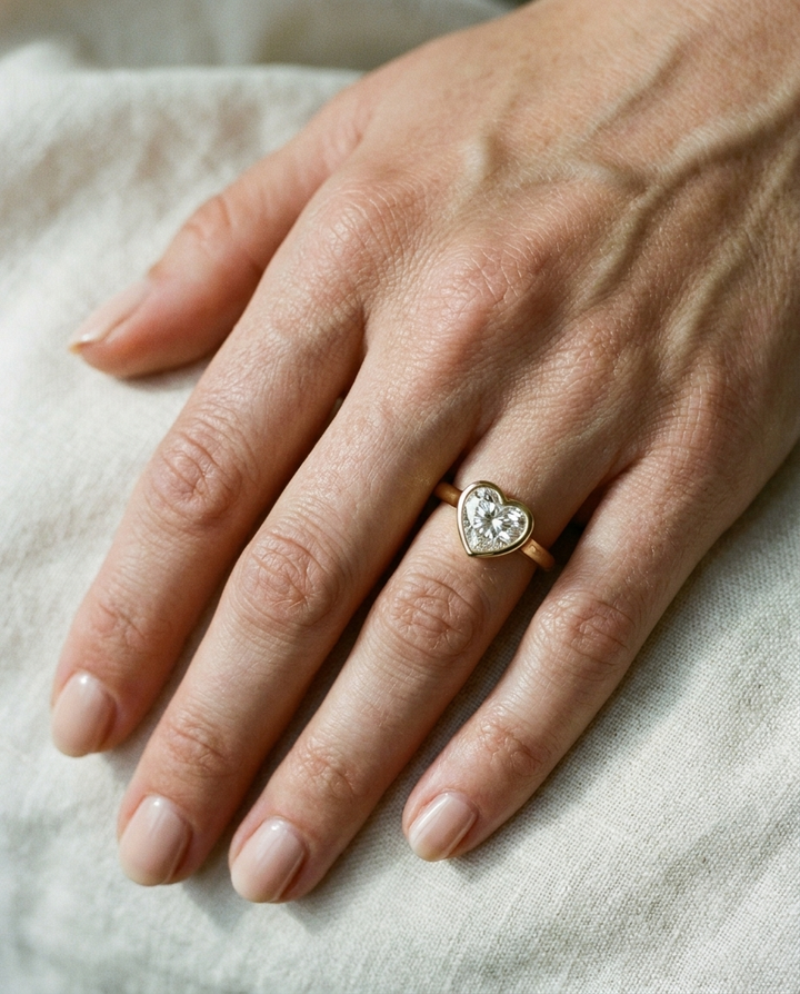 Agnes Heart bezel solitaire engagement ring setting in 18K Yellow Gold — on hand — RockHer