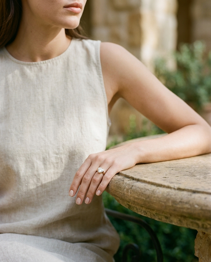 The Agnes bezel solitaire heart engagement ring setting in platinum — lifestyle — RockHer