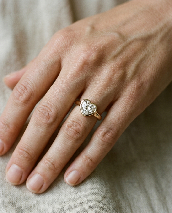 The Agnes Select bezel solitaire heart engagement ring in 18k white gold — on hand — RockHer