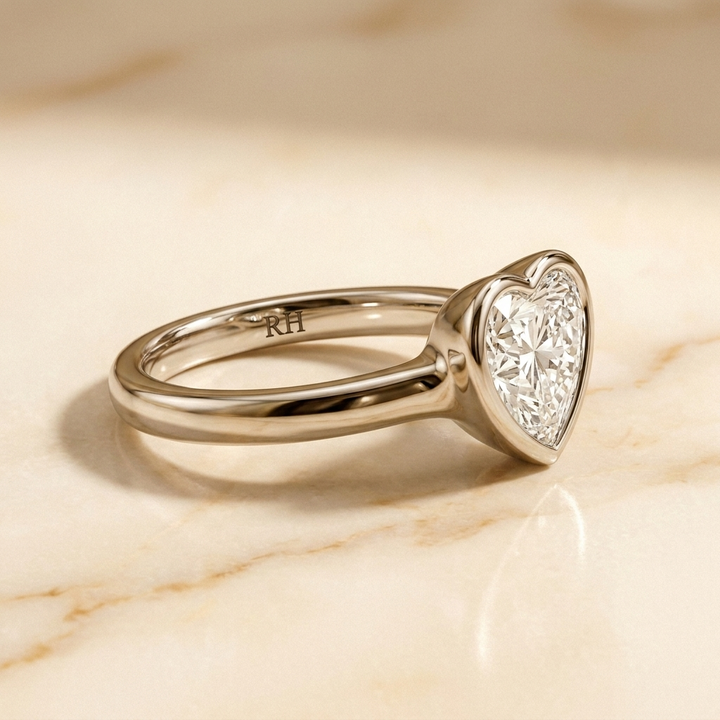The Agnes Select bezel solitaire heart engagement ring in 18k white gold — side profile — RockHer