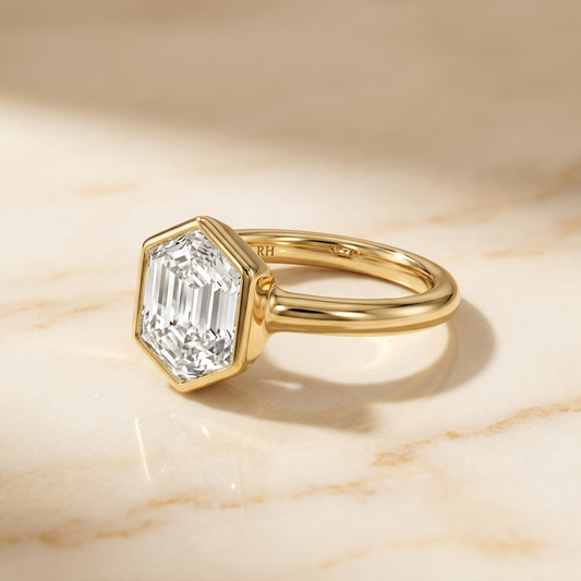 The Agnes Select bezel solitaire hexagonal engagement ring in 18k yellow gold — alt-angle hero — RockHer