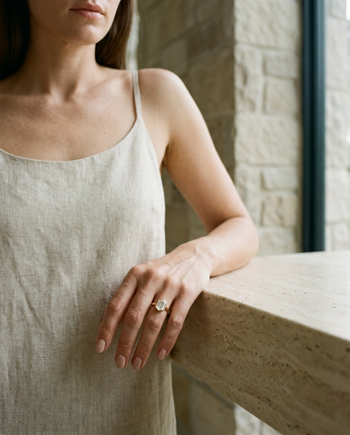 The Agnes Select bezel solitaire hexagonal engagement ring in 18k yellow gold — lifestyle — RockHer