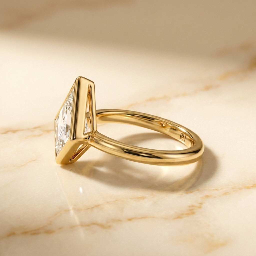 The Agnes Select bezel solitaire kite engagement ring in 18k yellow gold — side profile — RockHer