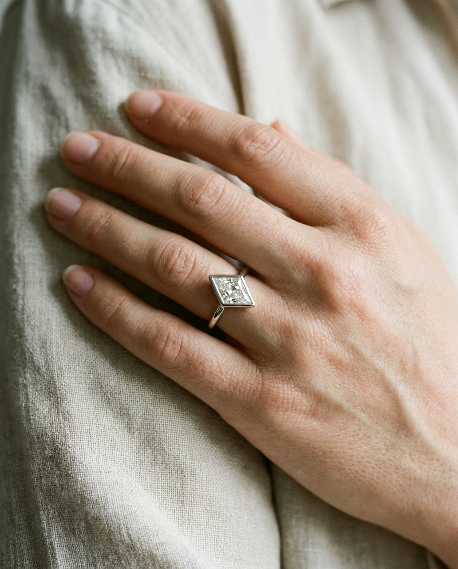 The Agnes Select bezel solitaire kite engagement ring in 18k white gold — on hand — RockHer