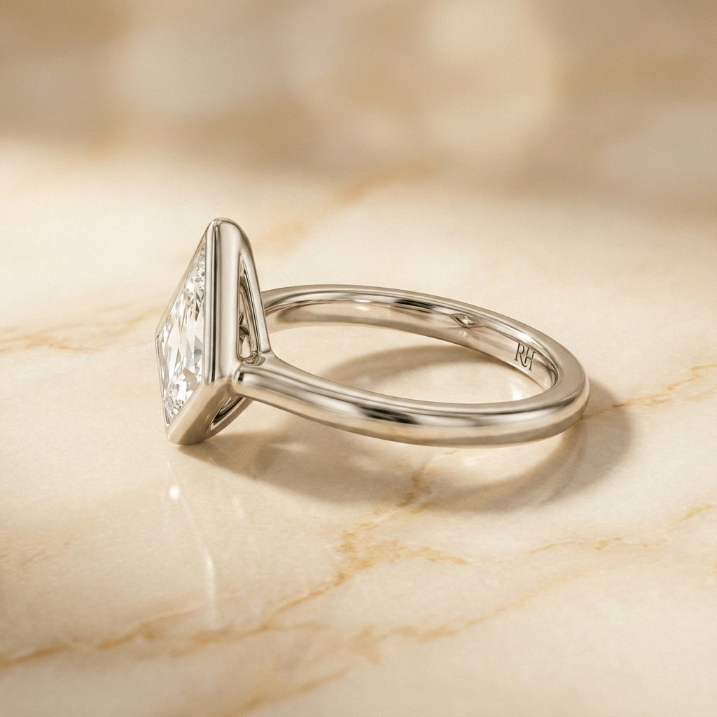 The Agnes Select bezel solitaire kite engagement ring in 18k white gold — side profile — RockHer